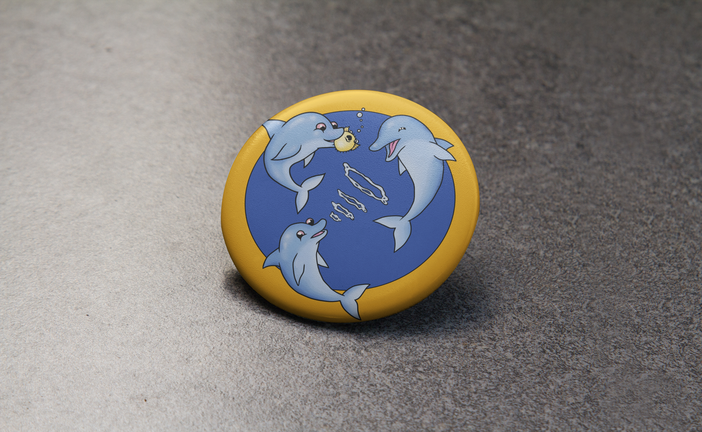 Dolphins pin on table